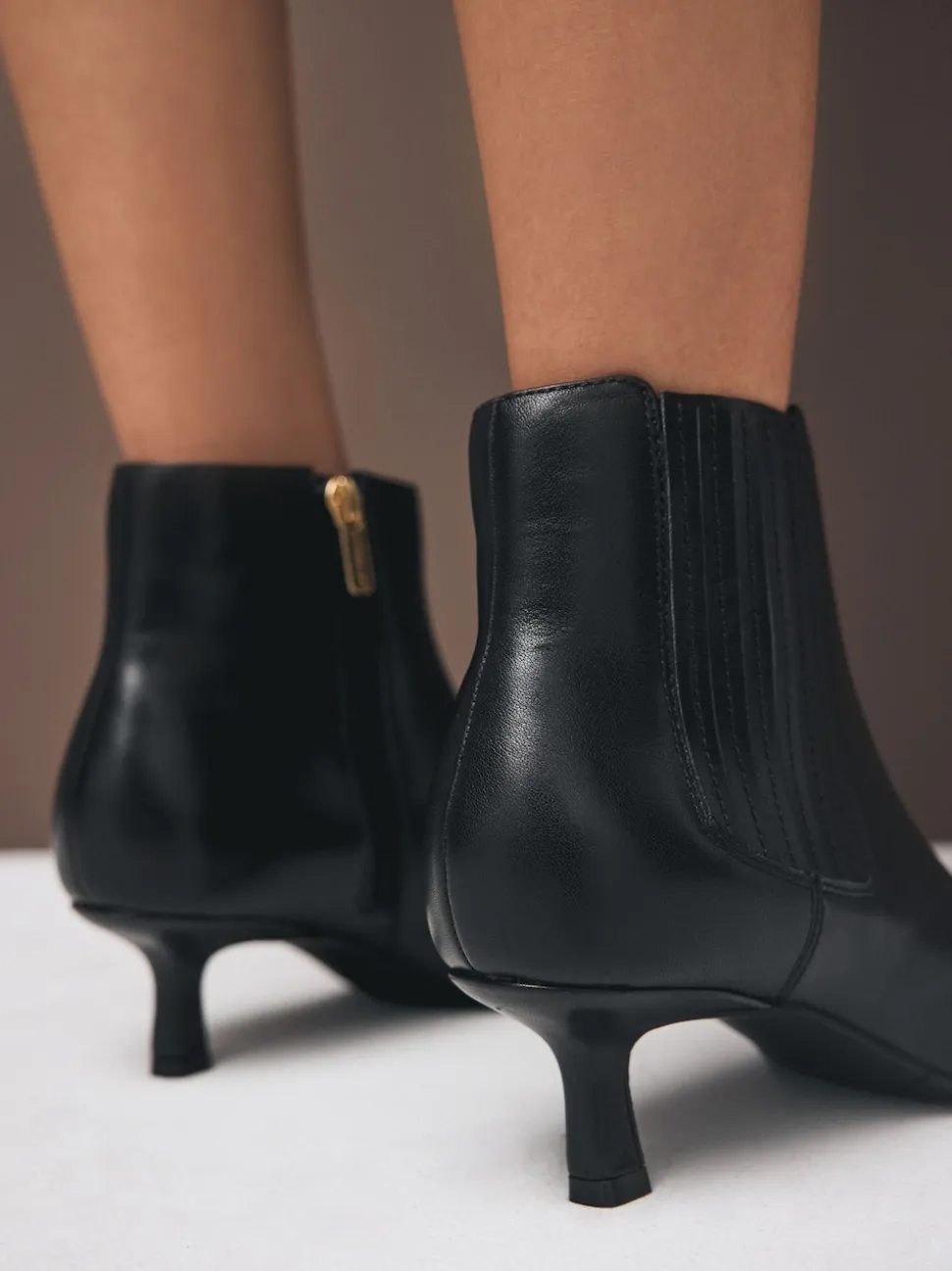 Black Leather Motion Flex Almond Toe Chelsea Style Ankle Boots