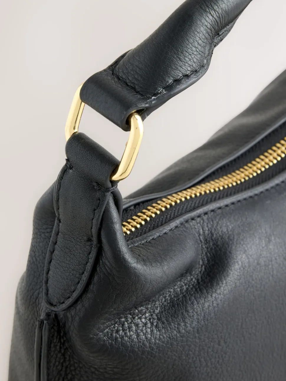 Black Leather Scooped Hand Held Bag