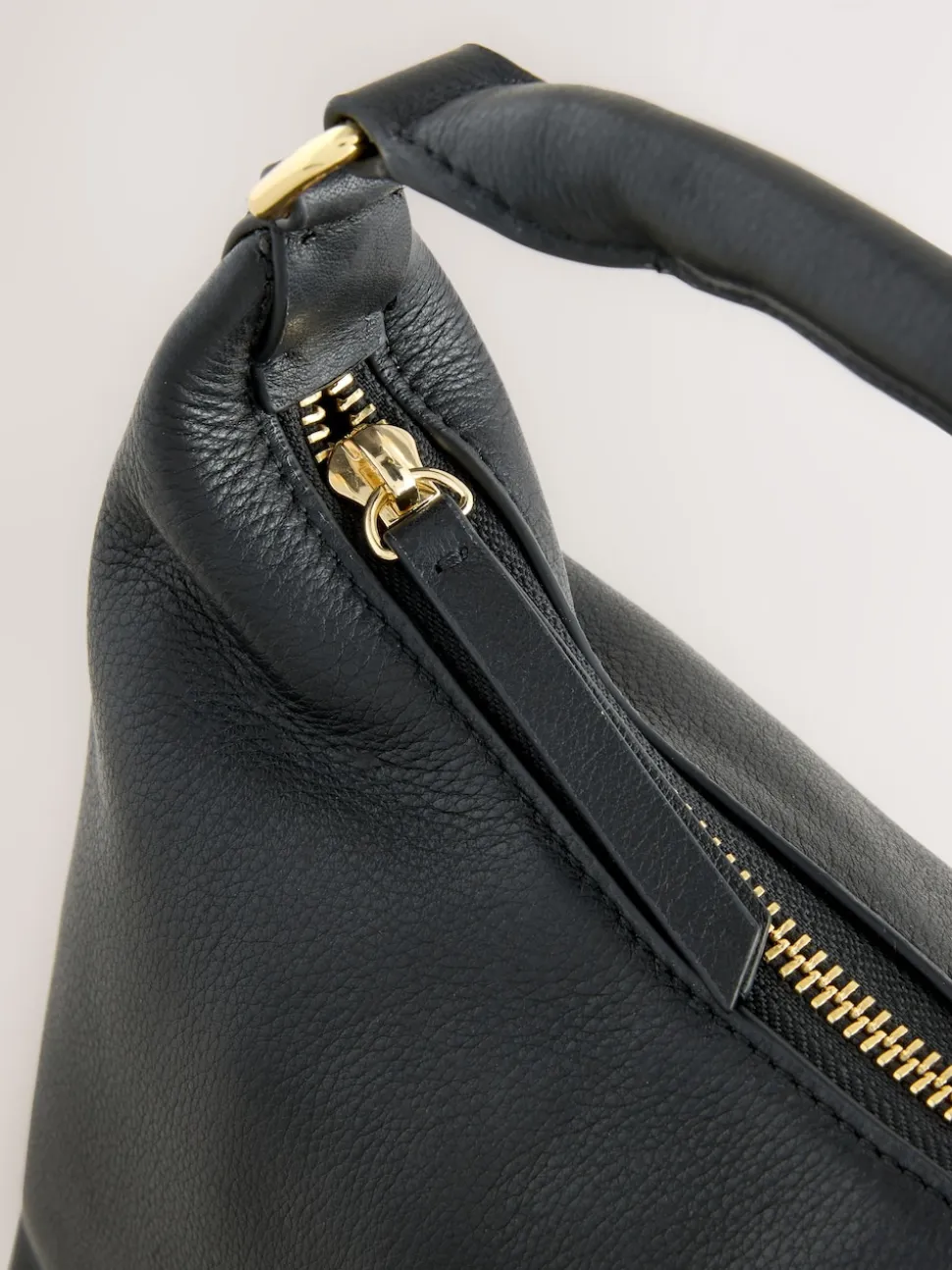 Black Leather Scooped Hand Held Bag