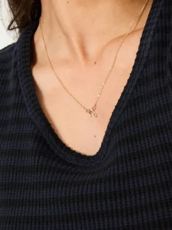 FatFace Gold Tone Bow Pendant Necklace