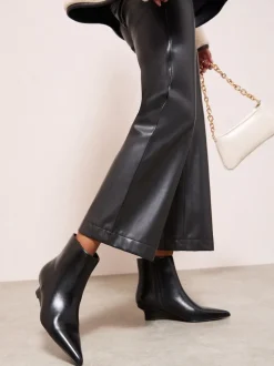 Friends Like These Black Faux Leather Low Wedge Formal Point Toe Ankle Boots