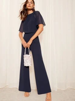 Friends Like These Navy Blue Petite Chiffon Flutter Sleeve Scuba Jumpsuit