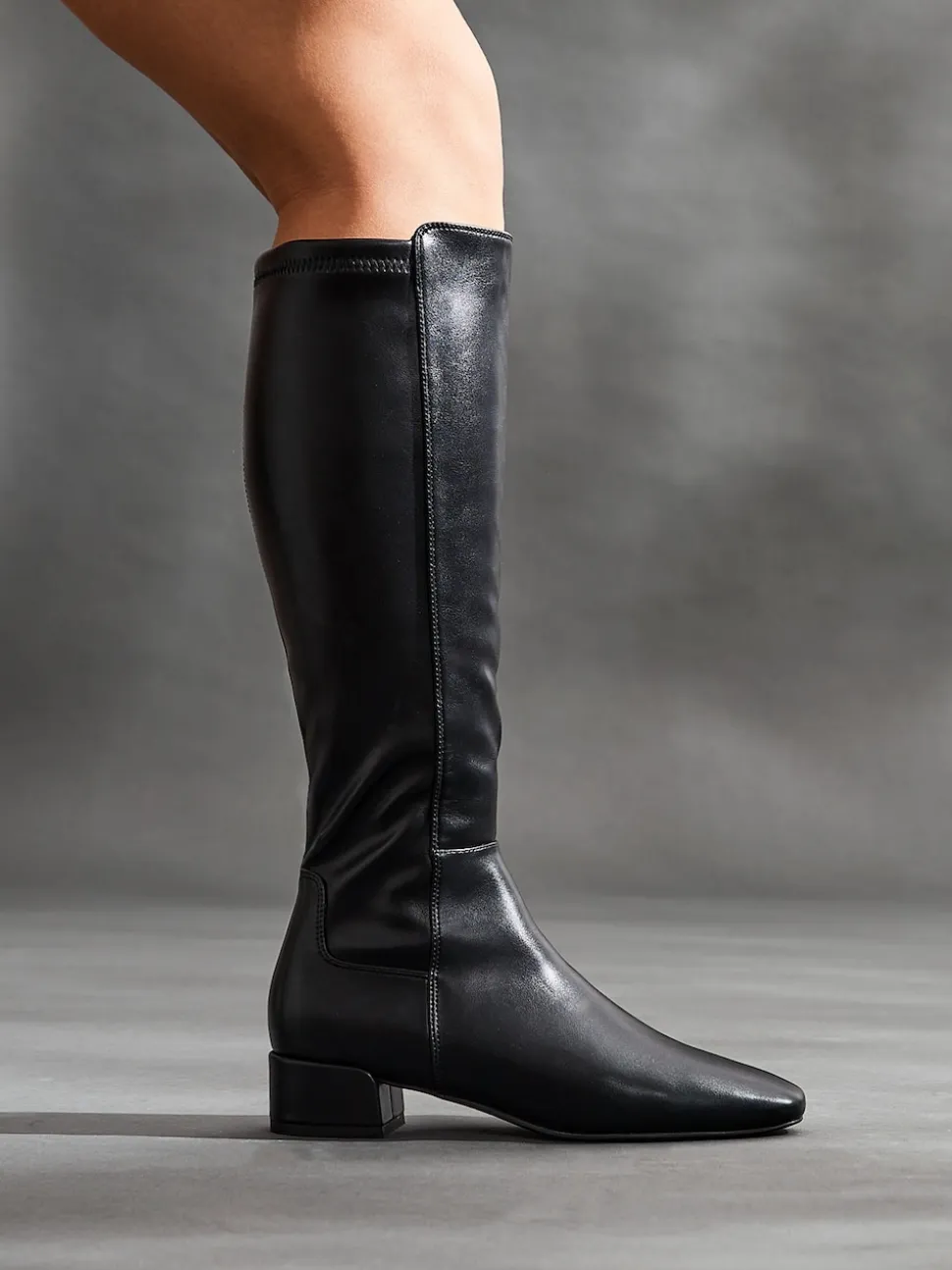 Linzi Black PU Revolve Stretch High Leg Boot With Low Block Heel