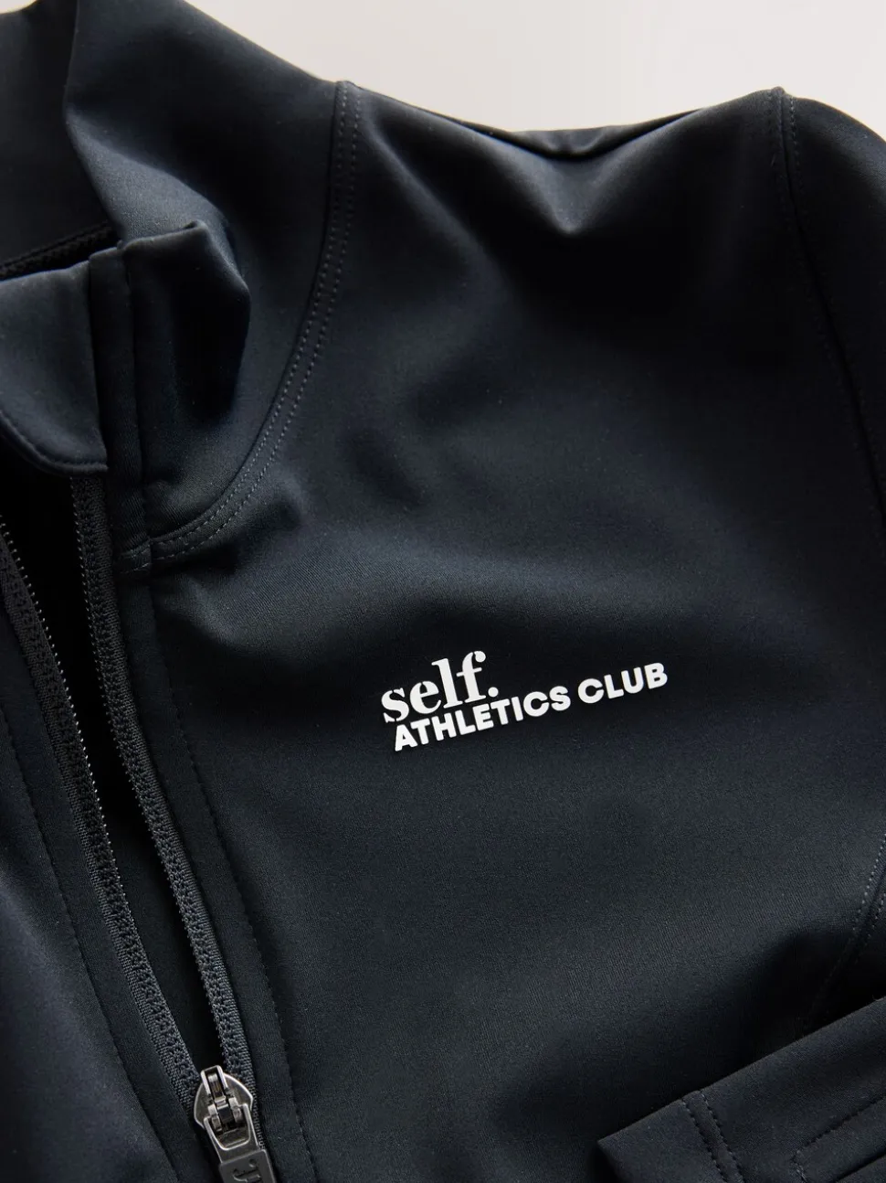 self. Black Long Sculpting Zip Through Jacket